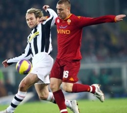 Pavel Nedved (left) battling it out with Daniele De Rossi
