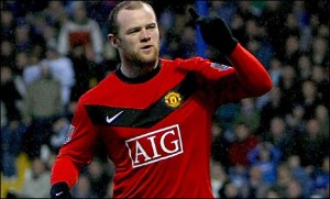 Wayne Rooney celebrates on his way to a hat-trick in Manchester United's win at Portsmouth
