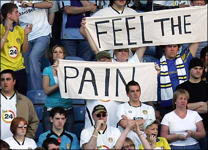Leeds fans watch on as their team is relegated from the Championship