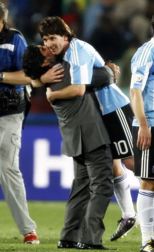  The ultimate hands-on manager: Diego Maradona celebrates with Leo Messi
