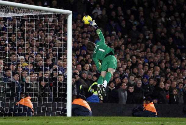 Manchester United's goalkeeper David de Gea makes a save during their English Premier League soccer match against Chelsea at Stamford Bridge in London