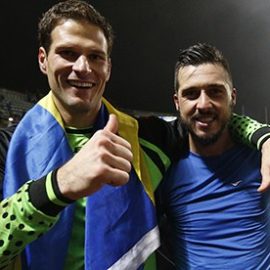 Bosnia's Asmir Begovic and Haris Medunjanin celebrate their victory over Lithuania