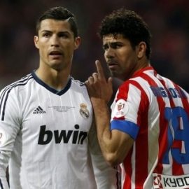 Real Madrid's Cristiano Ronaldo (L) listens to Atletico de Madrid's Diego Costa during their Spanish King's Cup final soccer match at Santiago Bernabeu stadium in Madrid May 17, 2013.   REUTERS/Juan Medina (SPAIN - Tags: SPORT SOCCER) - RTXZR28