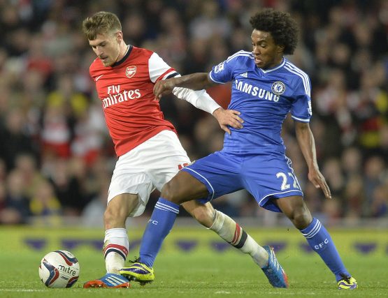 Arsenal's Ramsey challenges Chelsea's Willian during their English League Cup fourth round soccer match at Emirates Stadium in London