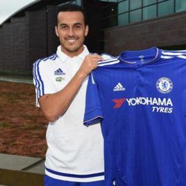 Pedro poses with a Chelsea shirt after his medical yesterday