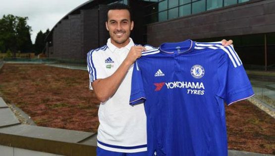 Pedro poses with a Chelsea shirt after his medical yesterday