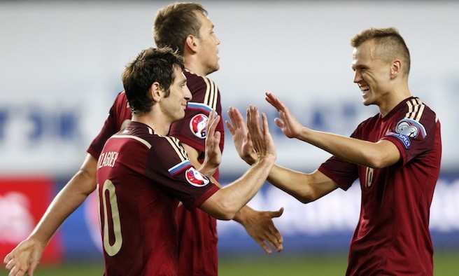 Russia's Alan Dzagoev, Artem Dzyuba and Denis Cheryshev celebrate a goal against Liechtenstein during their Euro 2016 Group G qualifying soccer match at the Arena Khimki outside Moscow