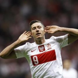 Poland's Lewandowski gestures as he celebrates scoring a goal against Montenegro during their 2014 World Cup qualifying soccer match in Warsaw
