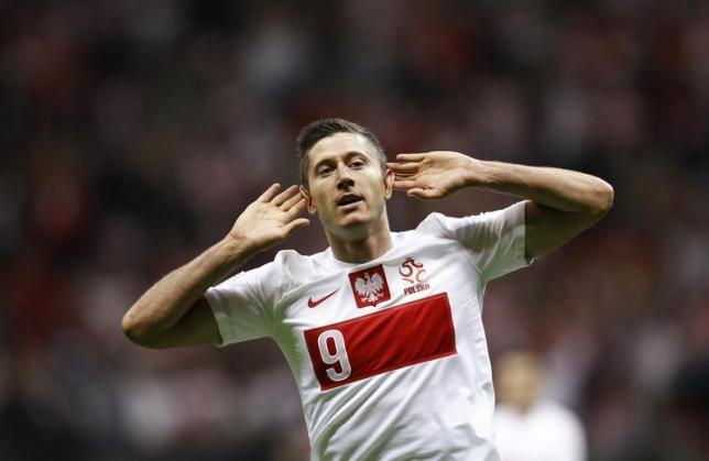 Poland's Lewandowski gestures as he celebrates scoring a goal against Montenegro during their 2014 World Cup qualifying soccer match in Warsaw