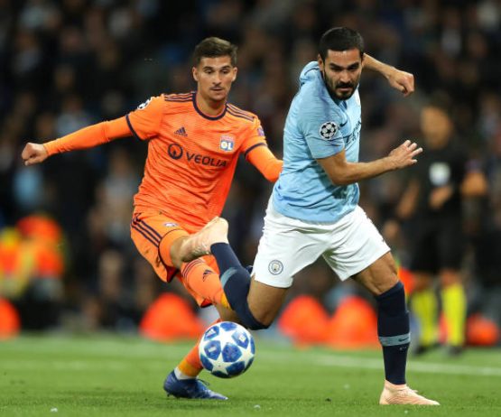 houssem-aouar-of-lyon-is-challenged-by-ilkay-gundogan-of-manchester-picture-id1036074014