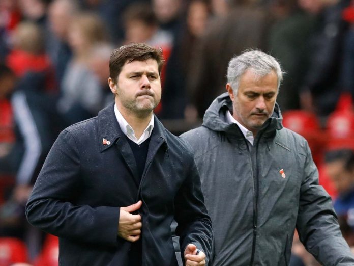 Pochettino-and-Mourinho-walk-the-touchline-at-Old-Trafford