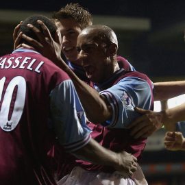 Darius Vassell of Aston Villa celebrates scoring Aston Villa's second goal with his team mates