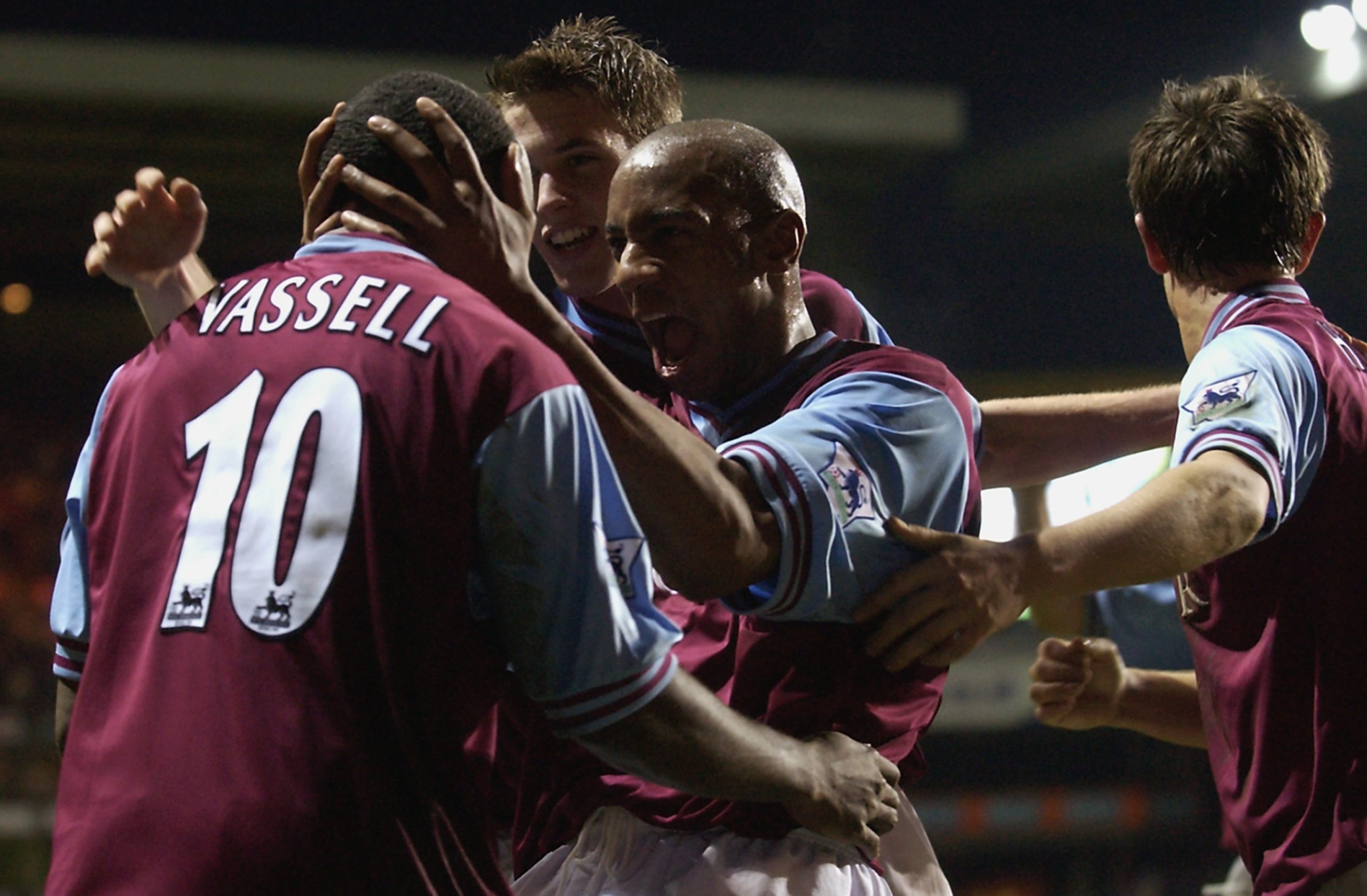 Darius Vassell of Aston Villa celebrates scoring Aston Villa's second goal with his team mates