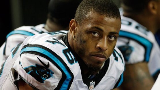 rsz greg hardy sits on bench as member of carolina panthers