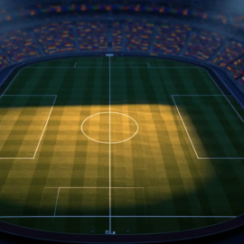 Aerial stadium view at dusk with floodlights, colourful bunting in stands, pitch centre-circle in focus, group-stage atmosphere.