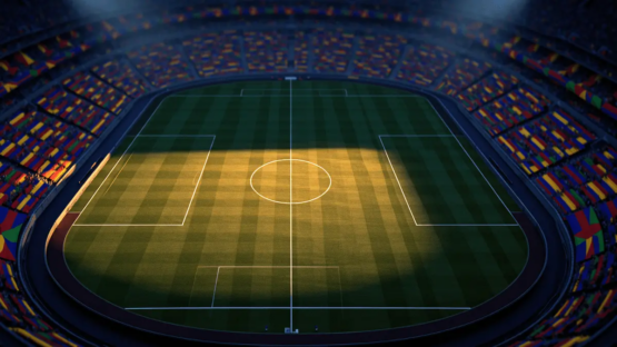 Aerial stadium view at dusk with floodlights, colourful bunting in stands, pitch centre-circle in focus, group-stage atmosphere.